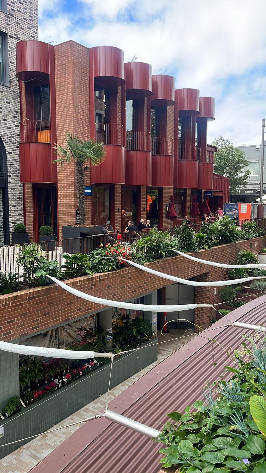 Façade presents as a seamless, striking architectural