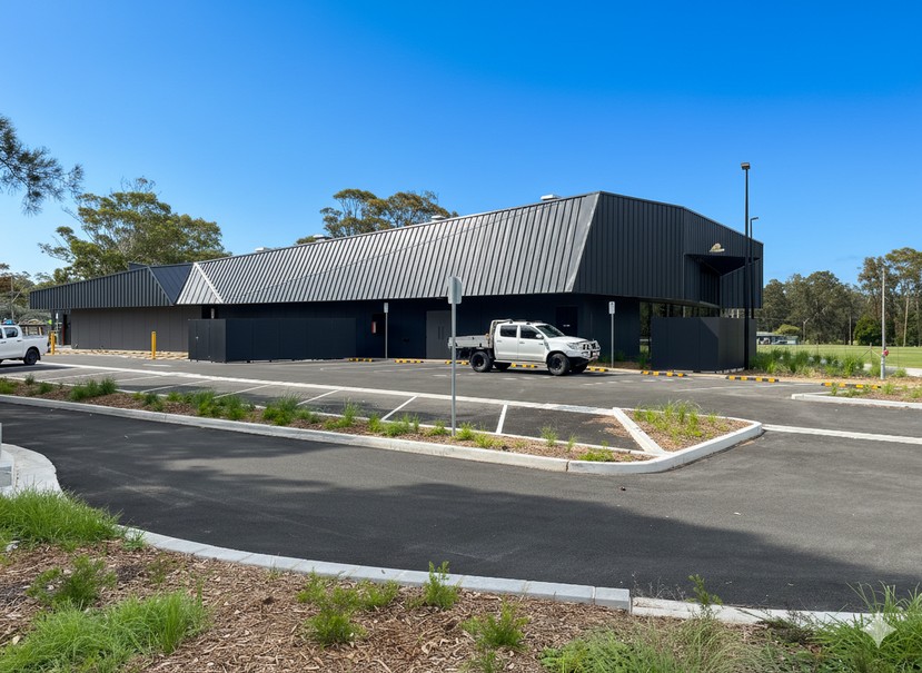Warriewood Community Centre has a modern standing‑seam look with clean lines, crisp ribs, and a sleek, contemporary finish